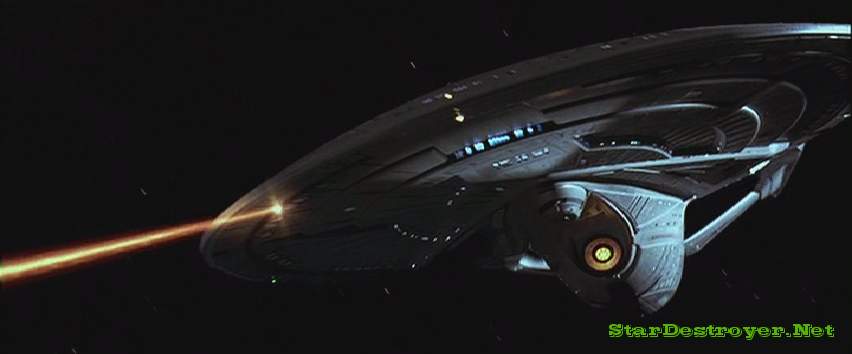 The Enterprise-E fires phasers at a Borg warship