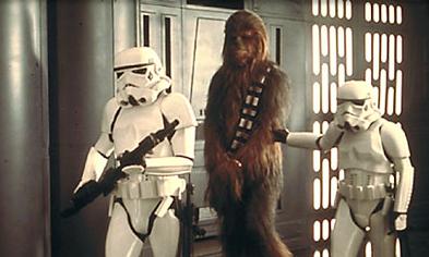 Han Solo, Luke Skywalker and Chewbacca sneaking around the Death Star. Notice Han's big gun.